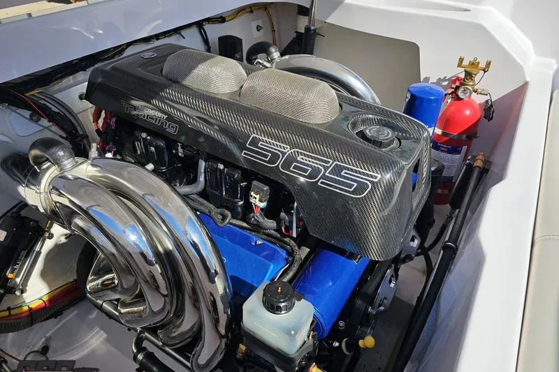 Slide: The Image of Engine compartment of a 2018 Baja 24 Outlaw boat with Mercury Racing 565 engine. - 97