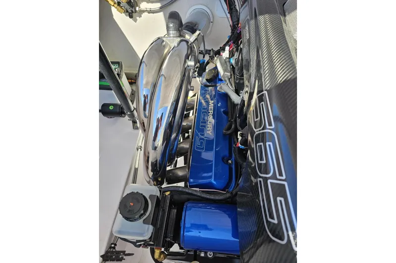 Slide: The Image of Engine compartment of a 2018 Baja 24 Outlaw boat with Mercury Racing components. - 99