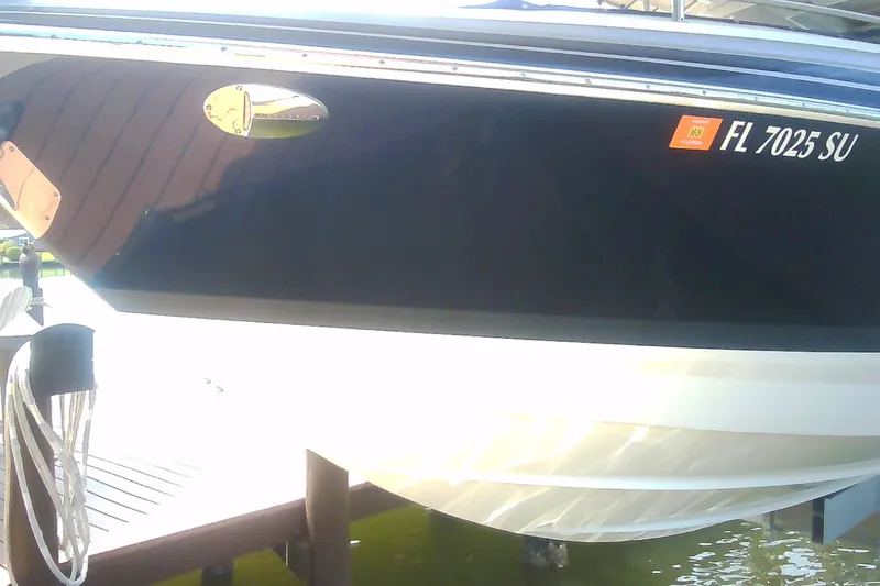 Slide: The Image of 2020 Formula 350 Crossover Bowrider docked, displaying Florida registration. - 17