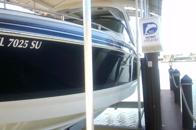 Slide: The Image of 2020 Formula 350 Crossover Bowrider docked, showcasing sleek design and modern features. - 19