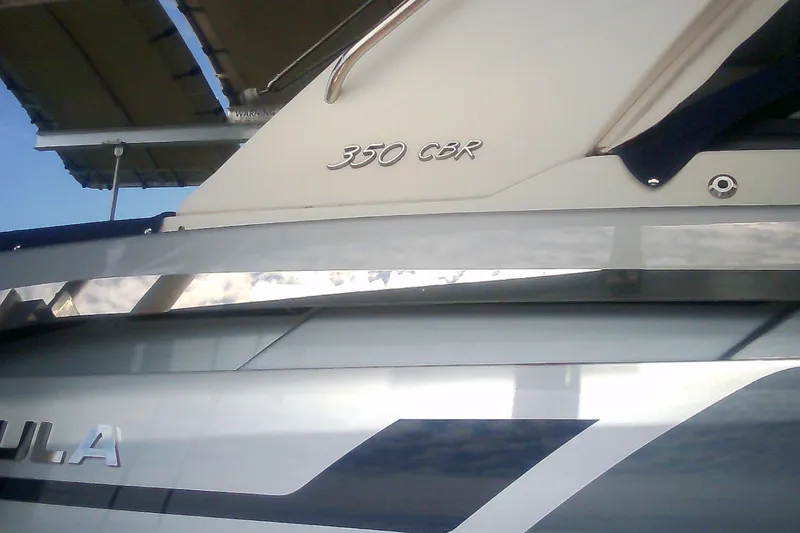 Slide: The Image of 2020 Formula 350 Crossover Bowrider boat, side view with model name visible. - 21
