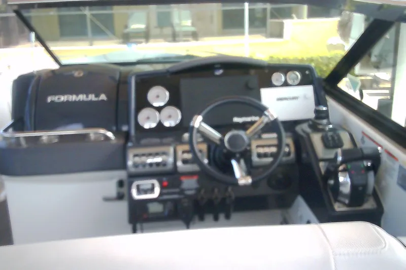 Slide: The Image of 2020 Formula 350 Crossover Bowrider dashboard with steering wheel and control panel. - 27