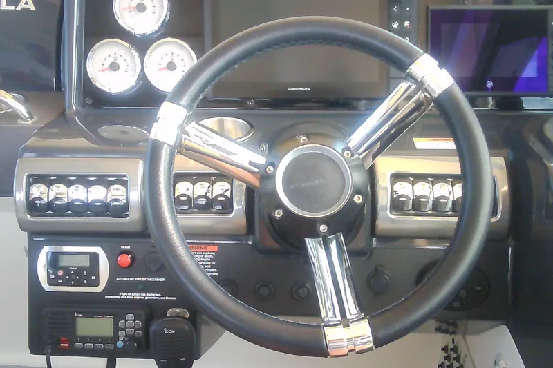 Slide: The Image of 2020 Formula 350 Crossover Bowrider dashboard with steering wheel and control panel. - 28