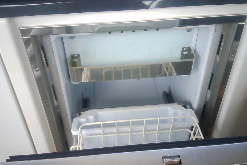 Slide: The Image of Open refrigerator compartment on a 2020 Formula 350 Crossover Bowrider boat. - 40