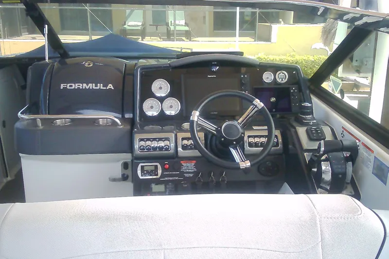 Slide: The Image of 2020 Formula 350 Crossover Bowrider helm with modern controls and steering wheel. - 49