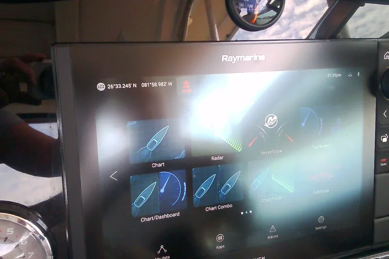 Slide: The Image of Raymarine navigation display on 2020 Formula 350 Crossover Bowrider boat dashboard. - 56