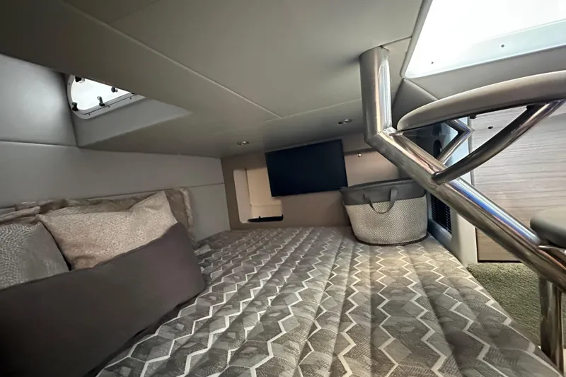 Slide: The Image of 2020 Formula 350 Crossover Bowrider cabin interior with bed and modern decor. - 58