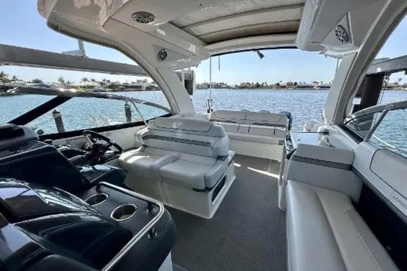 Slide: The Image of 2020 Formula 350 Crossover Bowrider interior with luxurious seating and scenic water view. - 6