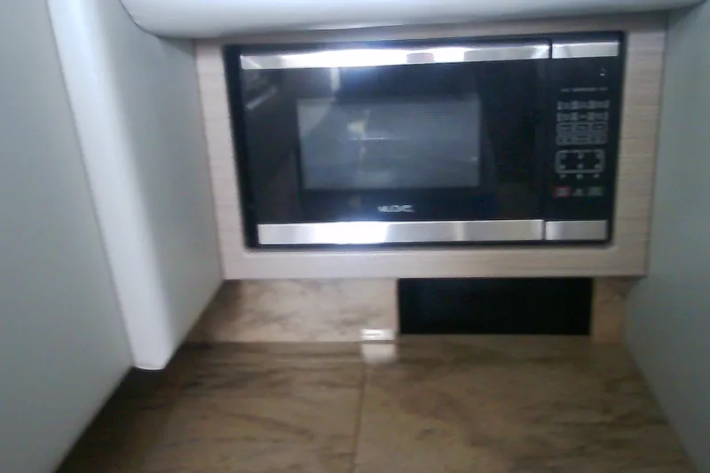 Slide: The Image of Built-in microwave in 2020 Formula 350 Crossover Bowrider kitchen area. - 60