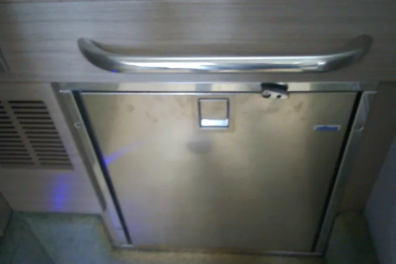 Slide: The Image of Stainless steel door on 2020 Formula 350 Crossover Bowrider boat interior. - 61