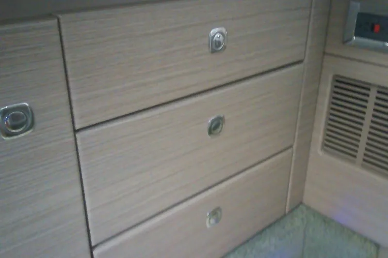 Slide: The Image of Interior cabinetry of 2020 Formula 350 Crossover Bowrider, featuring sleek wooden drawers and vent. - 62