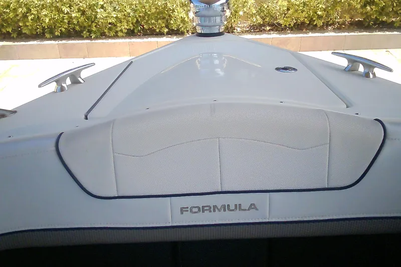 Slide: The Image of 2020 Formula 350 Crossover Bowrider boat bow with sleek design and branding. - 64