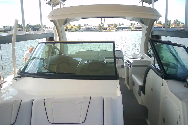 Slide: The Image of 2020 Formula 350 Crossover Bowrider on water, showcasing spacious interior and sleek design. - 72
