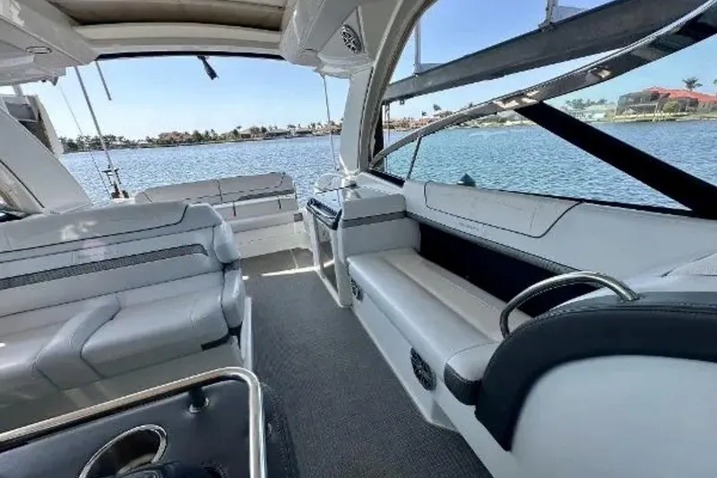 Slide: The Image of Interior of 2020 Formula 350 Crossover Bowrider with spacious seating and waterfront view. - 73