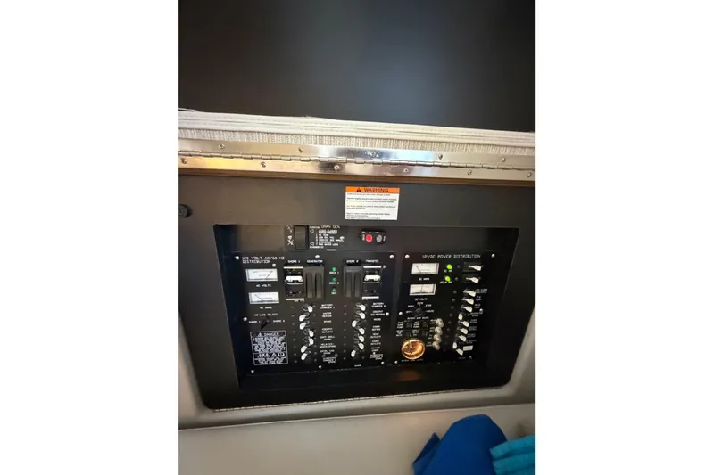 Slide: The Image of Control panel of 2022 Cruisers Yachts 38 GLS OB, featuring various switches and indicators. - 10