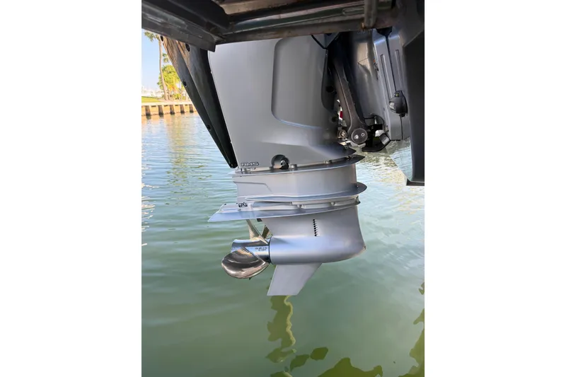 Slide: The Image of Outboard motor of 2022 Cruisers Yachts 38 GLS OB on water. - 14