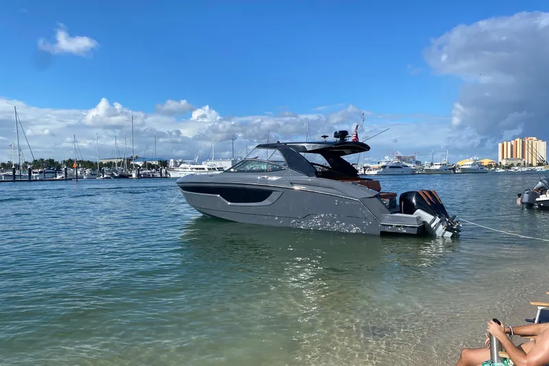 Slide: The Image of 2022 Cruisers Yachts 38 GLS OB in marina, sunny day, calm waters. - 3