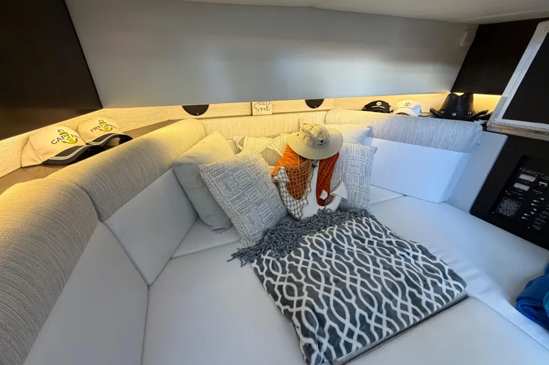 Slide: The Image of Luxurious interior of 2022 Cruisers Yachts 38 GLS OB with cozy seating and stylish decor. - 9
