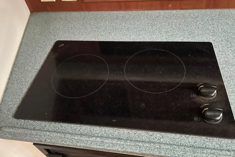 Slide: The Image of Ceramic cooktop with two burners in a 2005 Carolina Classic 35 boat kitchen. - 10