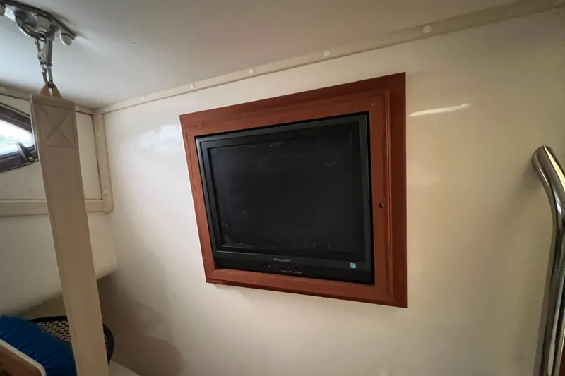 Slide: The Image of Wall-mounted TV in 2005 Carolina Classic 35 boat interior. - 11