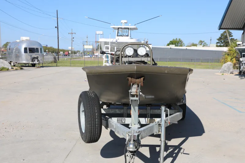 Slide: The Image of 2021 Gator Trax 1654 boat on trailer in outdoor setting. - 3