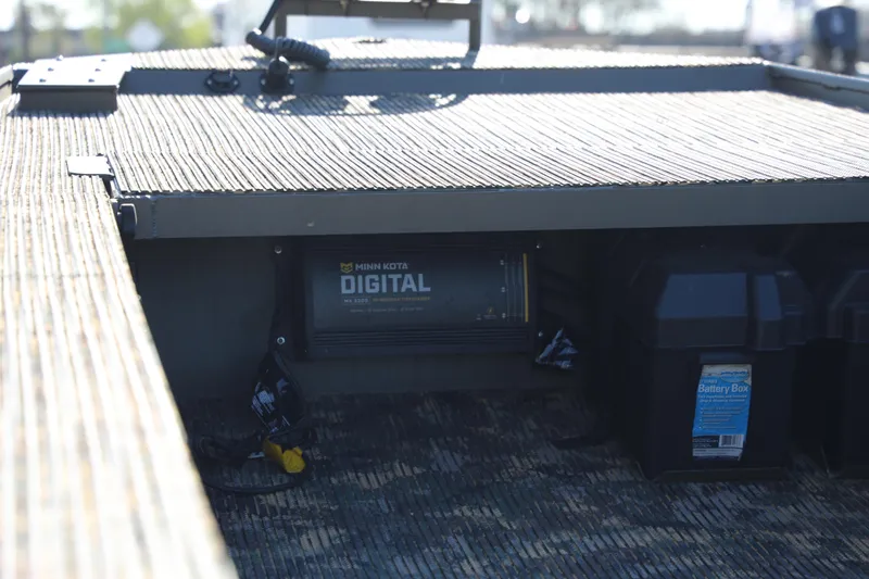 Slide: The Image of 2021 Gator Trax 1654 boat interior with Minn Kota digital charger and battery box. - 5