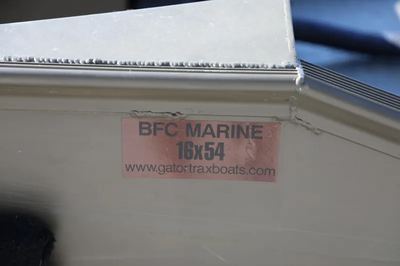 Slide: The Image of 2021 Gator Trax 1654 boat with BFC Marine label and website URL. - 7