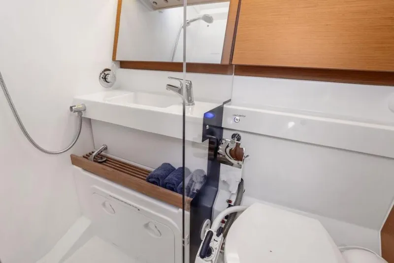 Slide: The Image of Modern bathroom in 2018 Jeanneau Sun Odyssey 440 yacht, featuring sleek fixtures and wooden accents. - 11