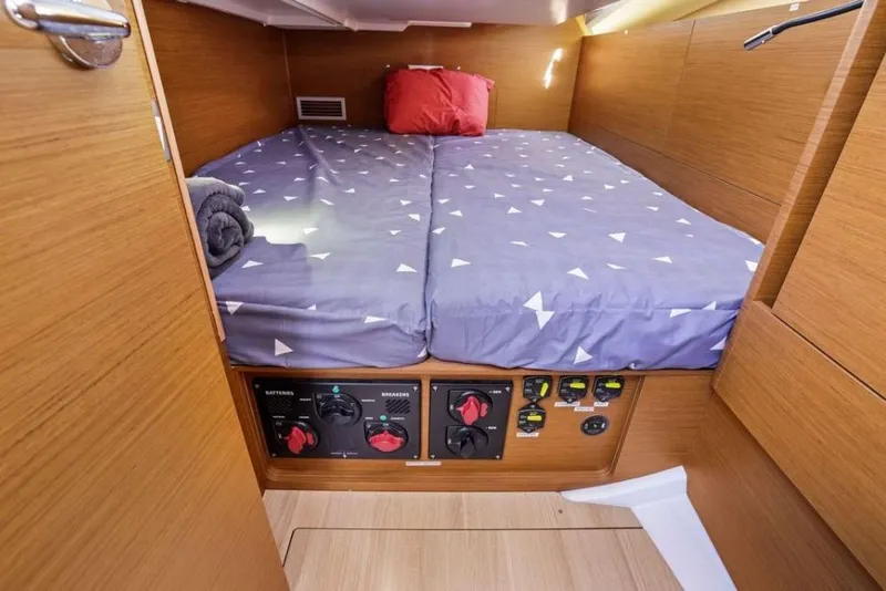 Slide: The Image of Cozy cabin interior of 2018 Jeanneau Sun Odyssey 440 sailboat with control panel. - 13