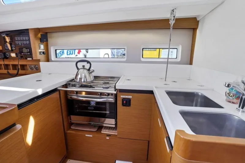 Slide: The Image of Interior of 2018 Jeanneau Sun Odyssey 440 yacht kitchen with stove and sink. - 15