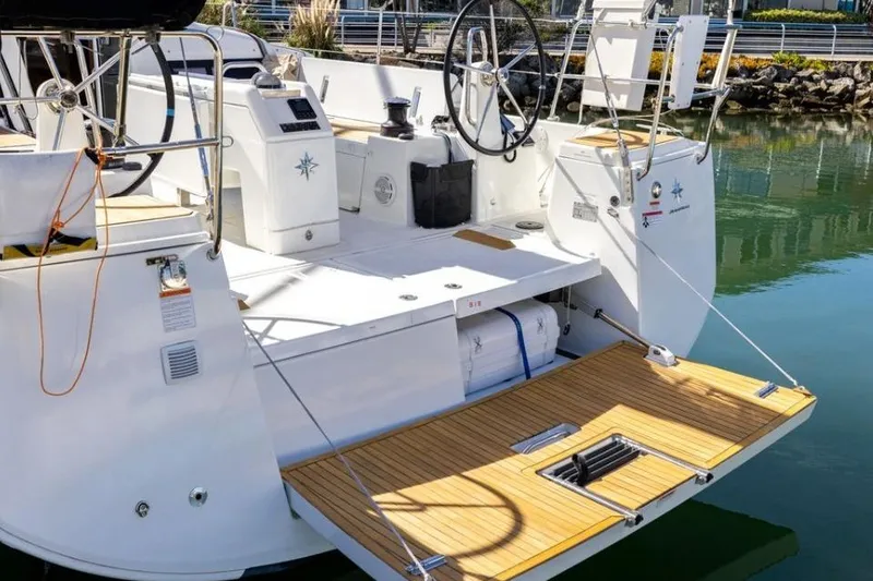 Slide: The Image of 2018 Jeanneau Sun Odyssey 440 yacht with open transom and dual steering wheels. - 22