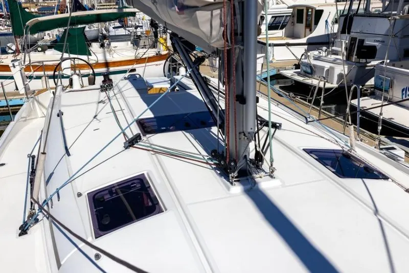 Slide: The Image of 2018 Jeanneau Sun Odyssey 440 sailboat deck view at marina. - 4