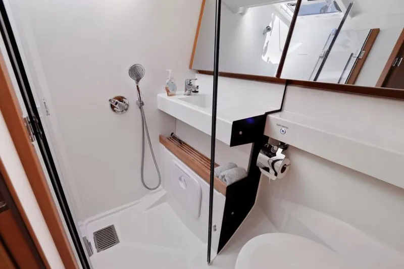 Slide: The Image of Modern bathroom in 2018 Jeanneau Sun Odyssey 440 yacht, featuring shower and sleek design. - 7