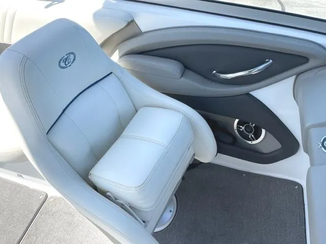 Slide: The Image of Interior of a 2011 Cobalt 242 WSS boat with white seating and wood flooring. - 10