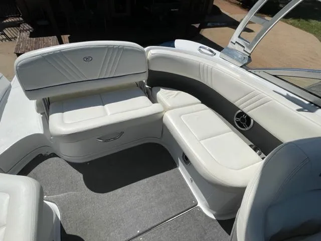 Slide: The Image of Captain's seat in 2011 Cobalt 242 WSS boat with sleek interior design. - 11