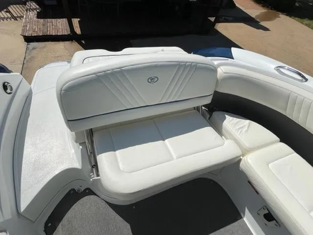Slide: The Image of Steering wheel and dashboard of 2011 Cobalt 242 WSS boat with gauges and controls. - 13