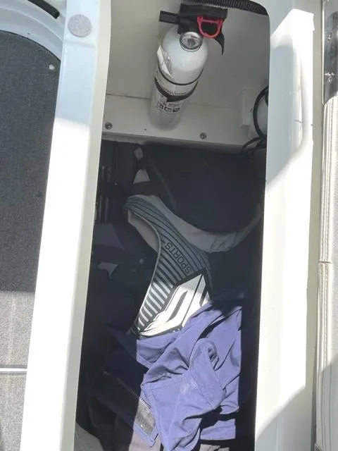 Slide: The Image of Covered dock with 2011 Cobalt 242 WSS boat, outdoor seating, and equipment. - 25