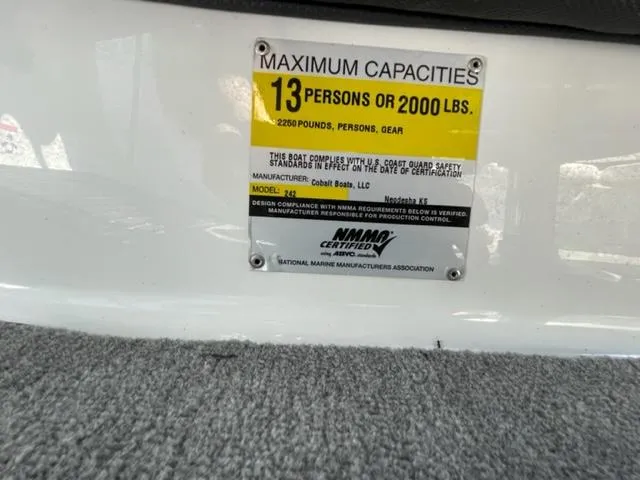 Slide: The Image of Outdoor seating area on dock with 2011 Cobalt 242 WSS boat nearby. - 26