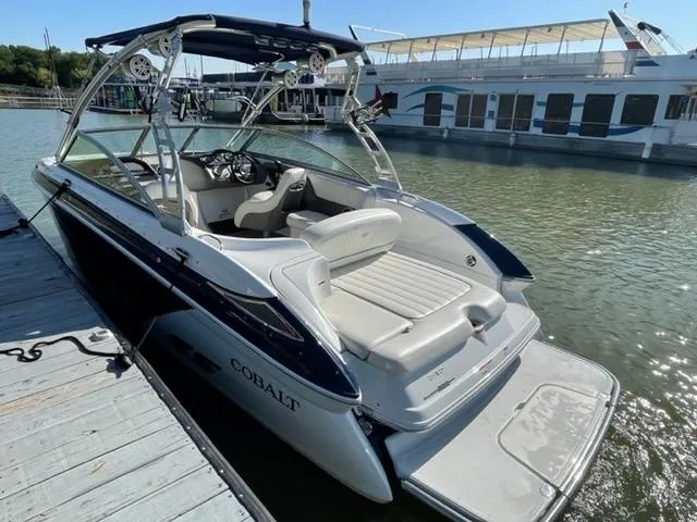 Slide: The Image of Worn upholstery on 2011 Cobalt 242 WSS boat seat, showing visible tears and wear. - 30