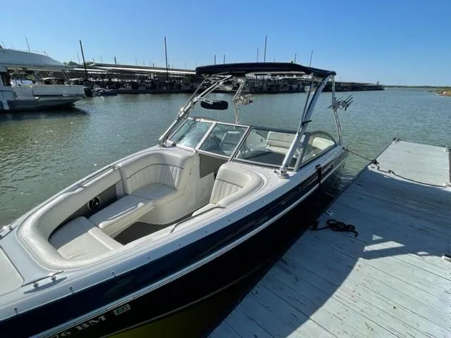 Slide: The Image of Trailer for 2011 Cobalt 242 WSS parked on suburban street. - 31