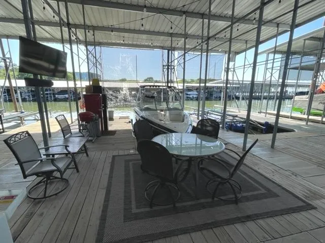 Slide: The Image of Boat trailer for 2011 Cobalt 242 WSS on concrete driveway. - 32