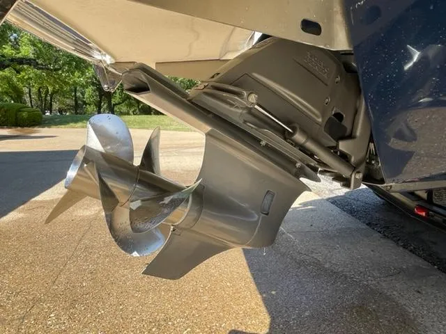 Slide: The Image of 2011 Cobalt 242 WSS boat with spacious seating and sleek design in a marina. - 6