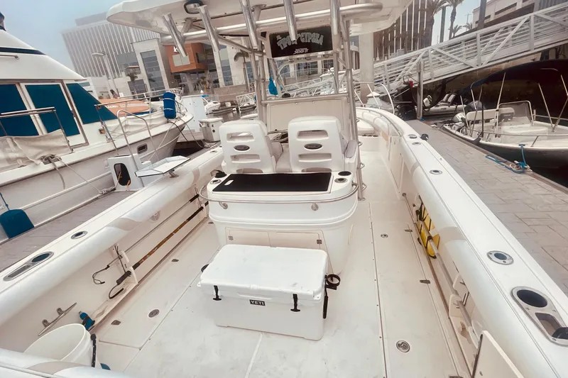 Slide: The Image of 2006 Boston Whaler 320 Outrage boat docked near Trader Joe's, featuring Mercury engines. - 3