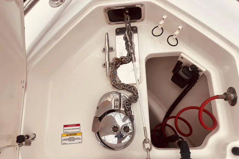 Slide: The Image of 2006 Boston Whaler 320 Outrage boat docked, featuring spacious deck and seating area. - 7