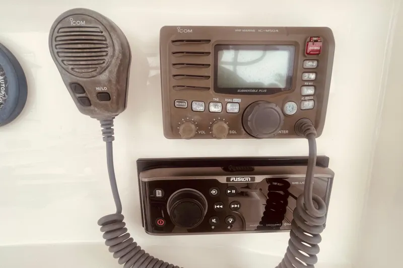 Slide: The Image of VHF marine radio and audio system on 2006 Boston Whaler 320 Outrage boat. - 13