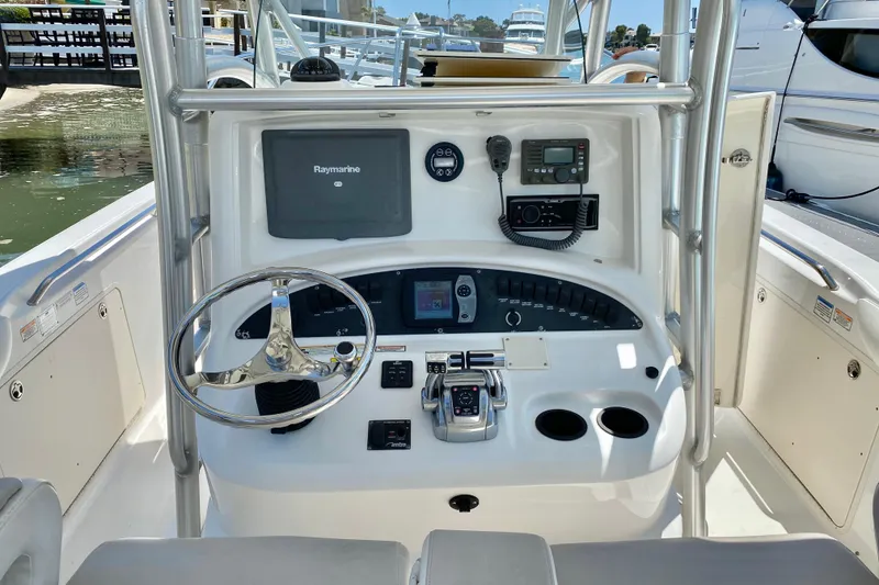 Slide: The Image of 2006 Boston Whaler 320 Outrage helm with Raymarine electronics and modern controls. - 15