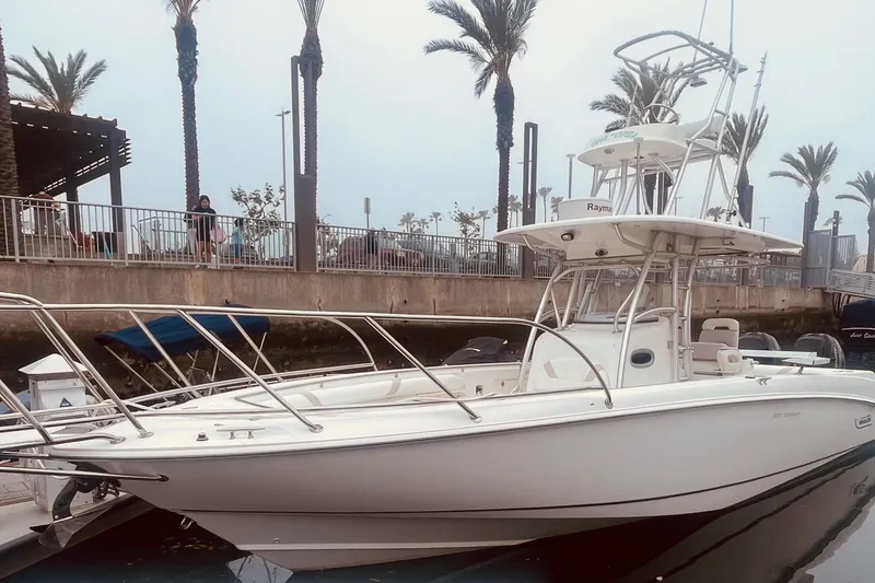 Slide: The Image of 2006 Boston Whaler 320 Outrage boat docked at night in a marina. - 5