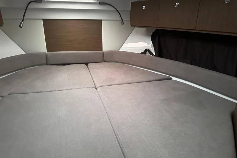 Slide: The Image of Interior cabin of 2023 Beneteau Antares 9 with comfortable seating and storage cabinets. - 23