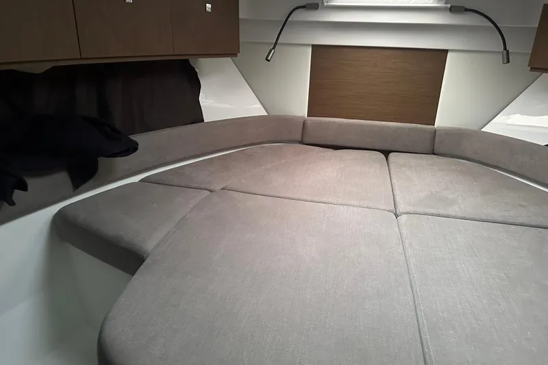Slide: The Image of Interior cabin of 2023 Beneteau Antares 9 with cushioned seating and modern design. - 24