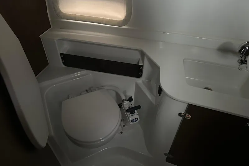 Slide: The Image of Bathroom interior of 2023 Beneteau Antares 9 boat, featuring toilet and sink. - 26